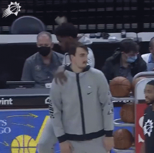 Man in Nike Jacket at Basketball Court