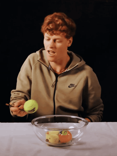 Man In Nike Jacket Holding Tennis Ball GIF