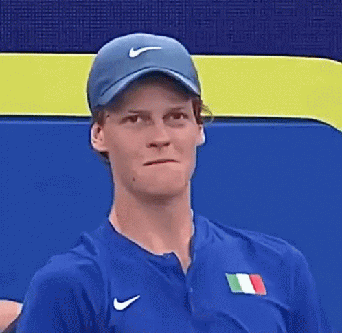 Man In Nike Jacket Holding Tennis Ball GIF