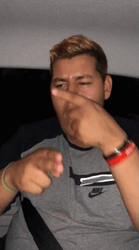 Man in Nike Shirt Pointing