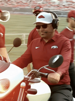 Man in Nike Shirt Riding White Motorcycle