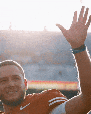 Man in Nike Shirt Waving Hand