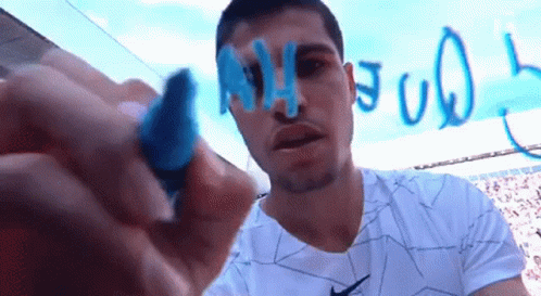 Man in Nike Shirt Writing on Whiteboard