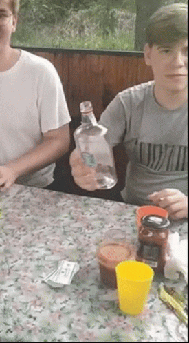 Man In Nirvana Shirt Holding Bottle GIF