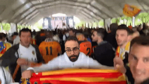 Man in Number 11 Jersey Holding Flag