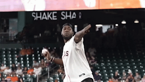 Man in Number 2 Shirt Throwing Soccer Ball