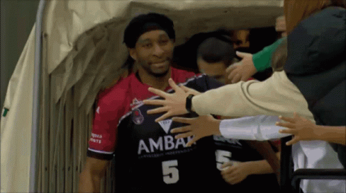 Man In Number 5 Jersey Being Hugged GIF