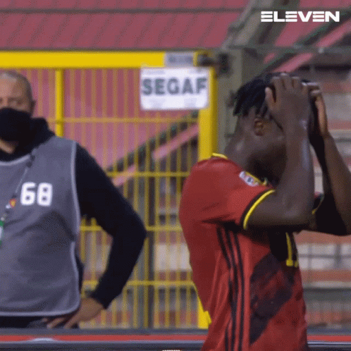 Man in Number 68 Jersey in Front of Segaf Sign