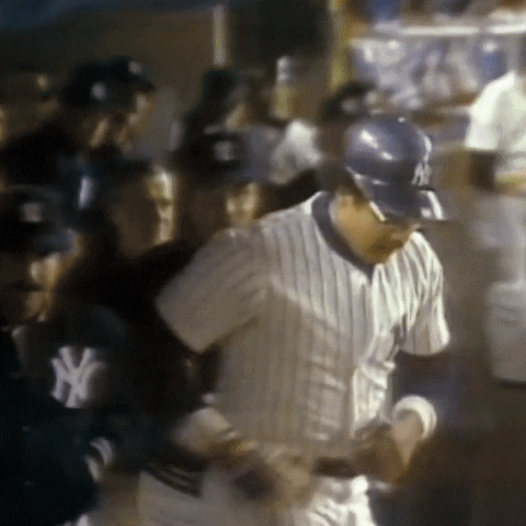 Man In NY Yankees Uniform In Crowd GIF