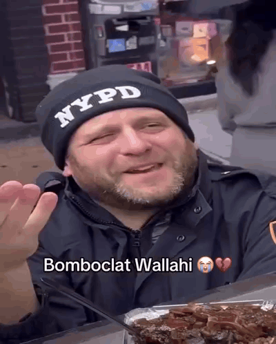 Man In NYPD Hat Sitting At Table With Food GIF