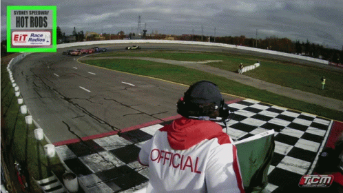 Man in Official Shirt Watching Sydney Speedway Race