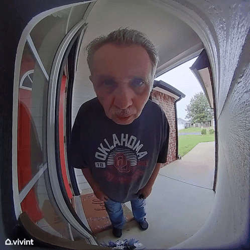 Man in Oklahoma Shirt Standing