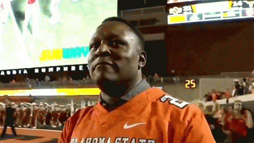 Man in Oklahoma State Jersey on Field