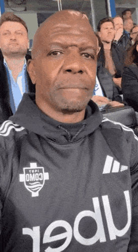 Man in Omo3 Jersey Taking Selfie in Stadium