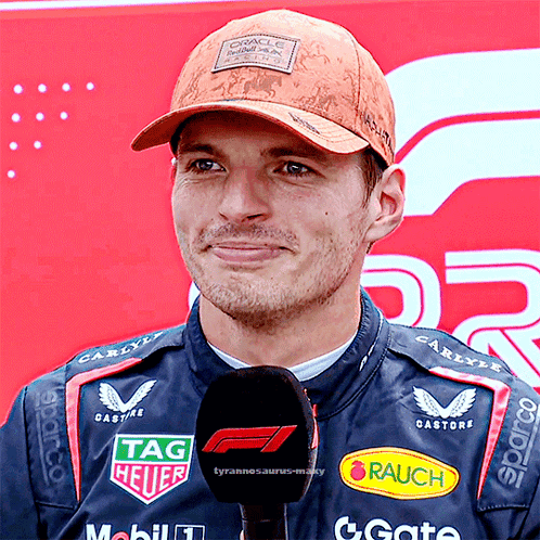 Man In Oracle Hat Holding Microphone GIF