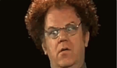 Man in Orange and Blue Sweater Making Funny Face
