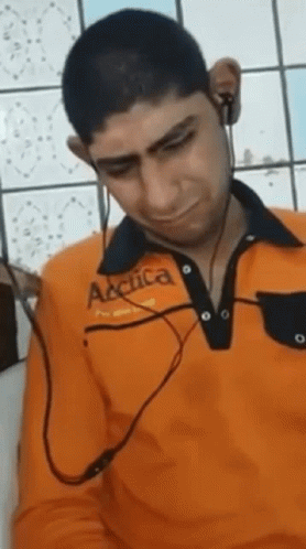 Man in Orange Arctica Shirt