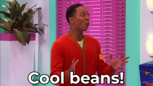 Man in Orange Cardigan Saying Cool Beans