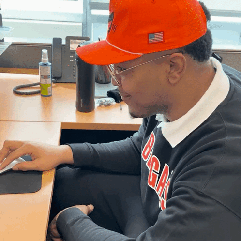 Man In Orange Hat And Black Sweater Saying BGA GIF