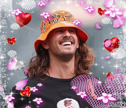Man in Orange Hat Surrounded by Flowers and Hearts