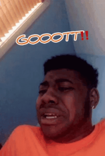 Man In Orange Shirt Making Funny Face Gocott GIF