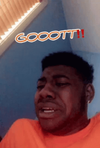 Man In Orange Shirt Making Funny Face With Gooott GIF