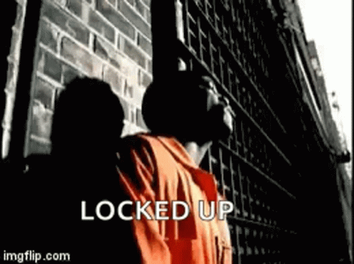 Man in Orange Shirt Saying Locked Up