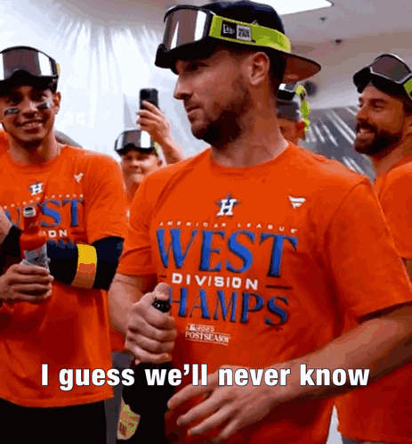 Man in Orange Shirt Saying West Division Champs