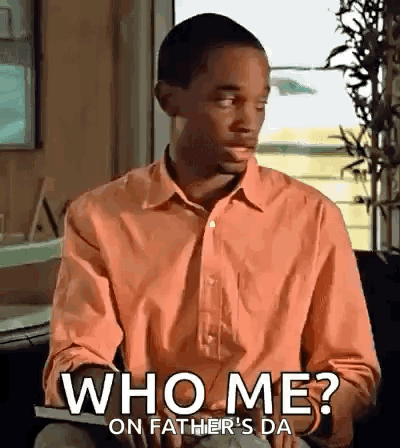 Man In Orange Shirt Saying Who Me GIF