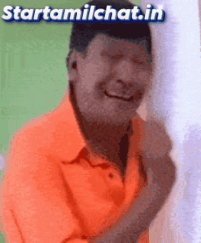 Man In Orange Shirt Smiling GIF