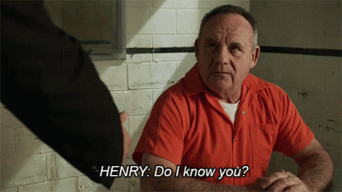 Man in Orange Shirt Talking to Henry