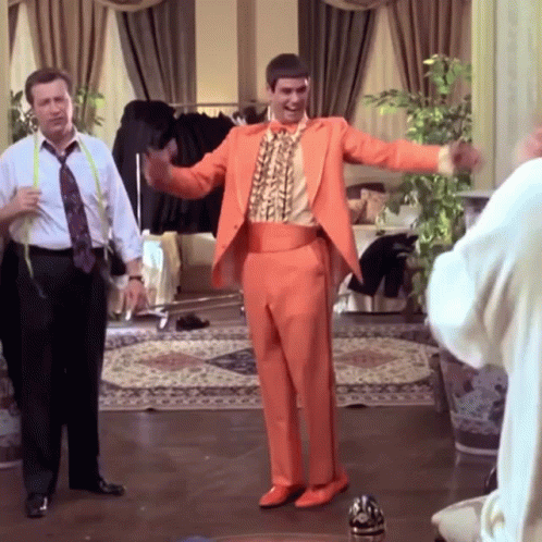 Man In Orange Suit Dancing GIF