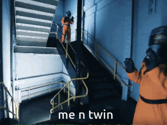 Man in Orange Suit Standing on Stairs