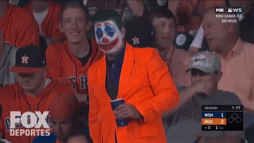 Man in Orange Suit Watching Baseball