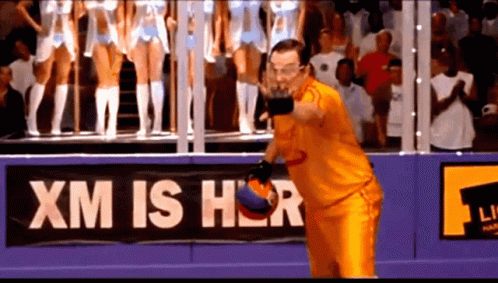 Man in Orange Throwing Basketball