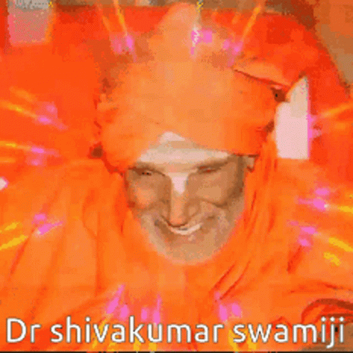 Man in Orange Turban Smiling Dr Shivakumar Swamji