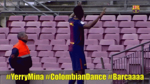 Man in Orange Vest Next to Soccer Player #yerrymina #Colombian Dance #Barcaaaa