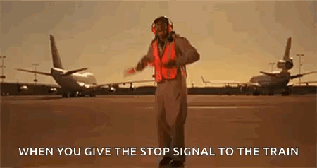 Man In Orange Vest Stop Signal Airport GIF