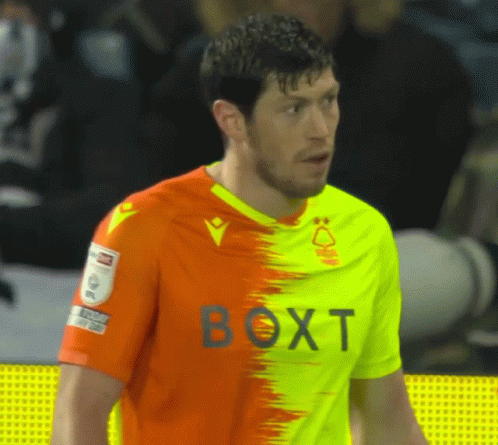 Man in Orange Yellow Shirt with Boxt