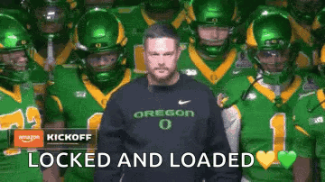 Man in Oregon Sweatshirt With Football Players