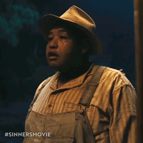 Man in Overalls and Striped Shirt with Sinners Movie