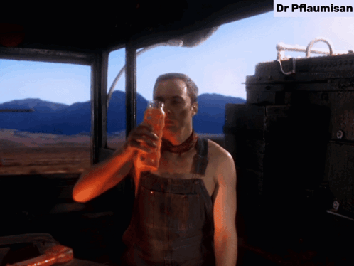 Man in Overalls Drinking Dr Pflaumisan