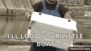 Man in Overalls Holding Cooler Says I'll Load Your Little Boat