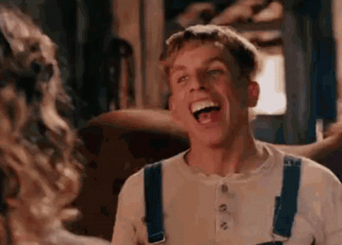 Man In Overalls Laughing With Woman GIF