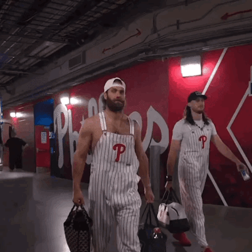 Man in Overalls With Letter P