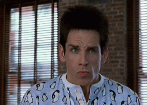 Man in Pajama Shirt with Penguins Looking at Camera