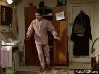 Man in Pajamas Dancing in Front of Wardrobe