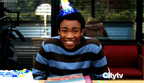 Man in Party Hat at Table