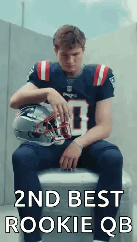 Man In Patriots Jersey Sitting On Cooler Holding Helmet GIF
