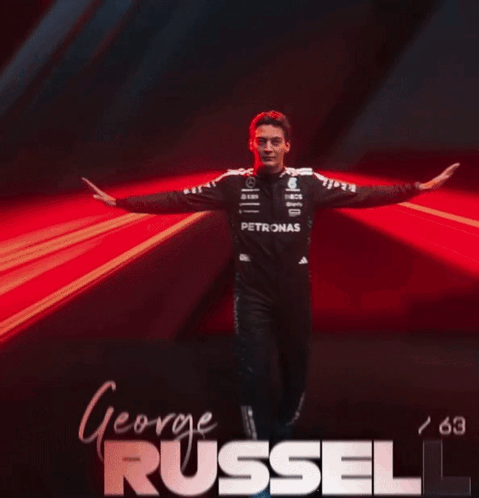 Man in Petronas Uniform Arms Outstretched George Russell